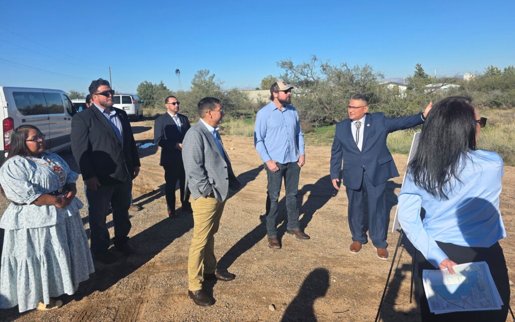 Chairman Rocha points toward the landscape while speaking with Assistant Secretary Billy Kirkland, Congressman Eli Crane, Vice Chairman Charlie Baca, and other Tribal leaders during the tour of the land exchange parcels near Cherry Creek Road.